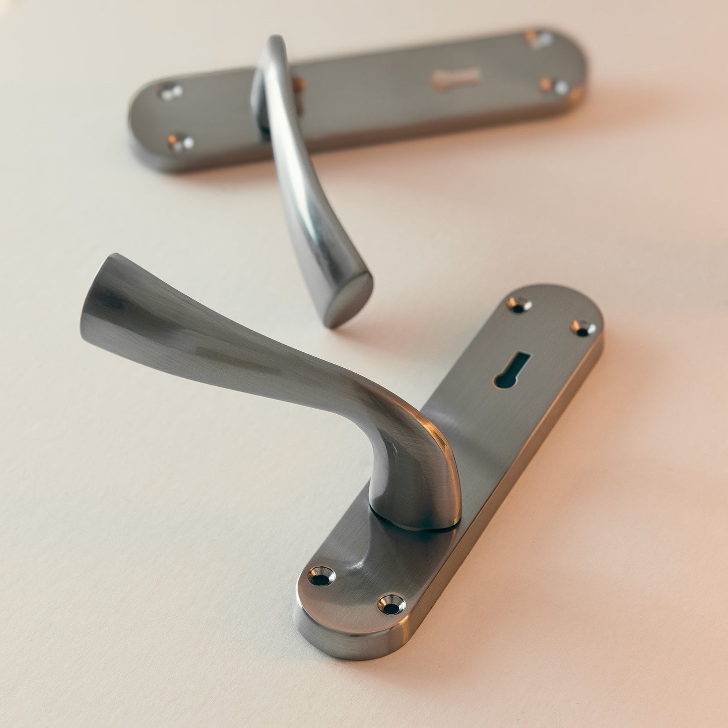 Scimitar Lever & Lock on Backplate Bathroom Door Handle Set - Satin Chrome (122293)