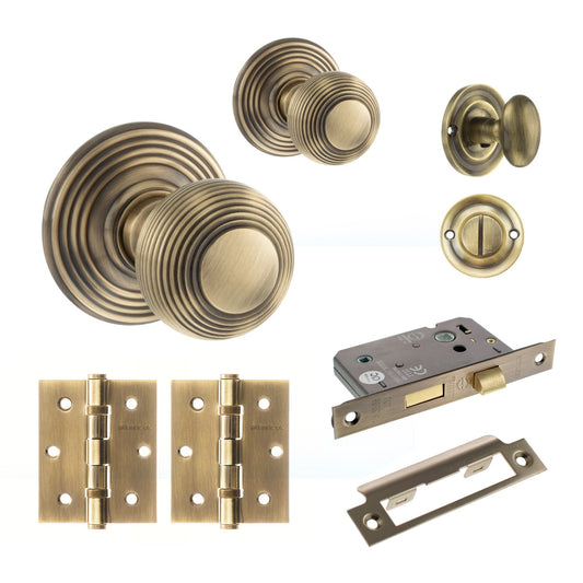 Ripon Round Reeded Mortice Bathroom Door Knob Set - Antique Brass