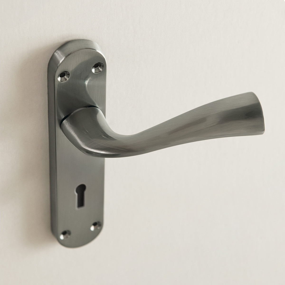 Scimitar Lever and Lock on Backplate Bathroom Door Handle Set - Satin Chrome